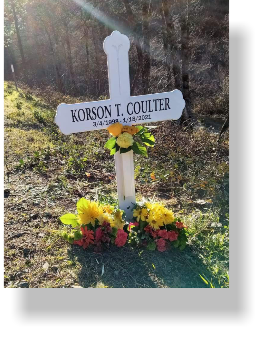 creative roadside cross with pictures
