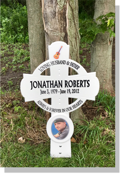 Road side memorial with guitar and picture